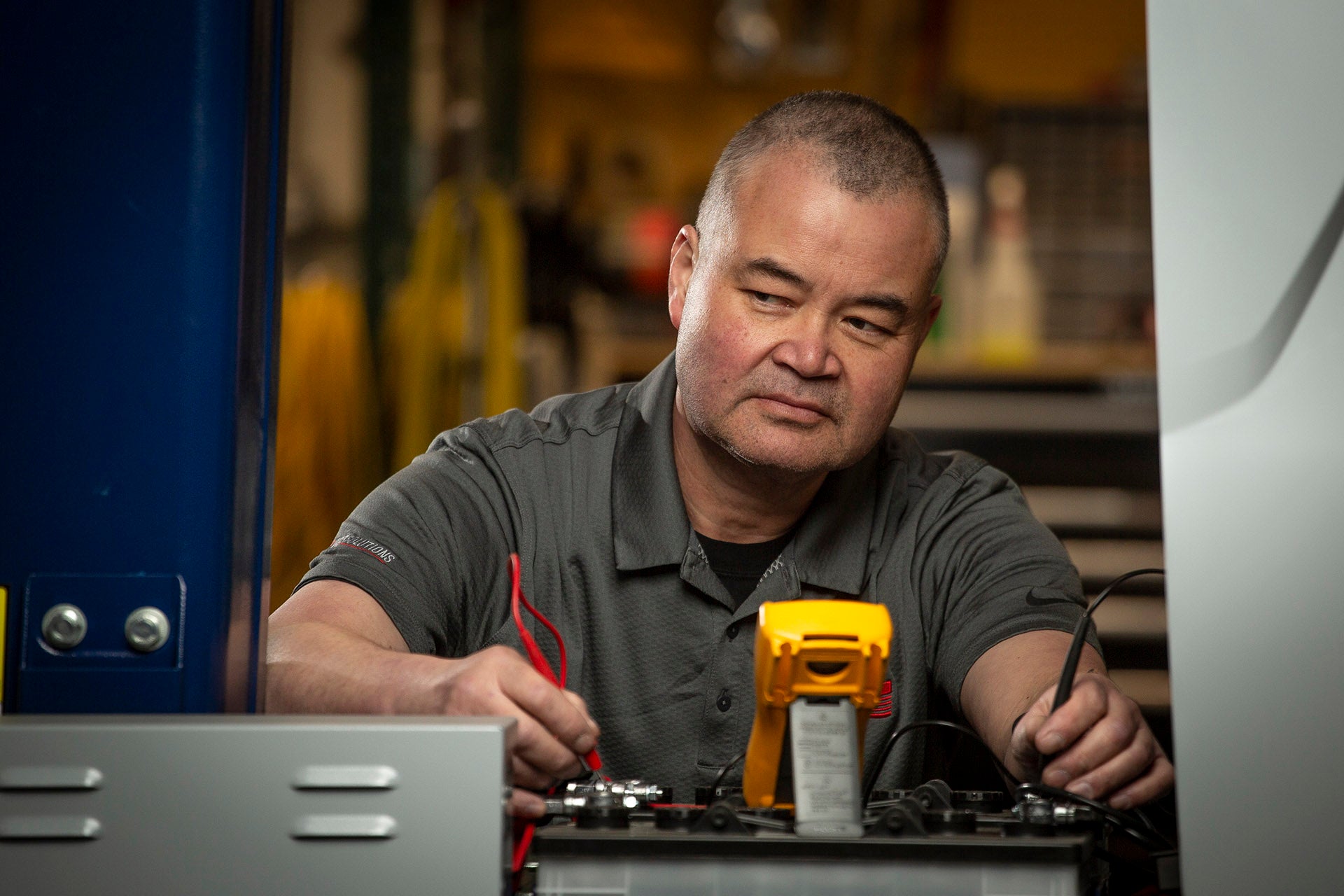 In-house equipment tech doing a service on packaging equipment at WCP Solutions.