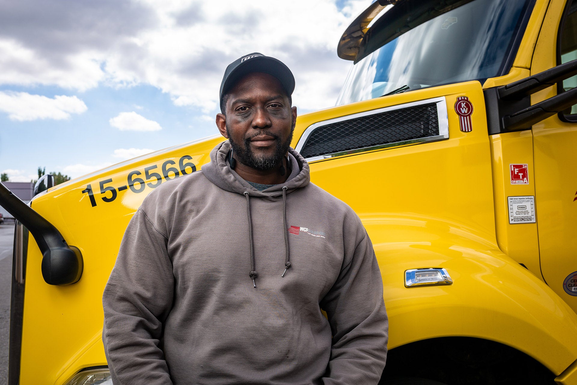 Ron leaning up against a WCP Truck