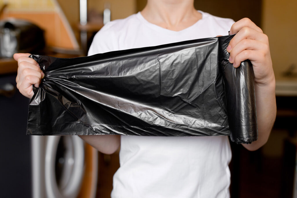 Person holding a Can Liner / Trash Bag